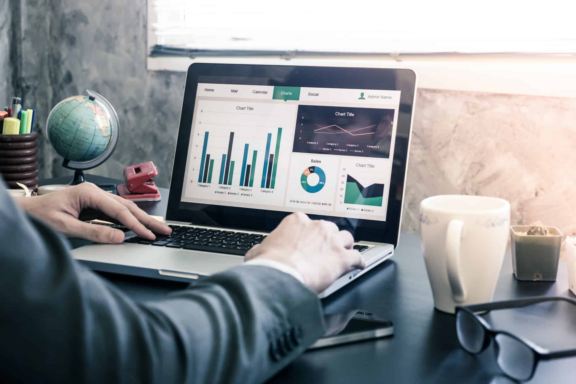 businessman analyzing investment charts on the office desk .jpg