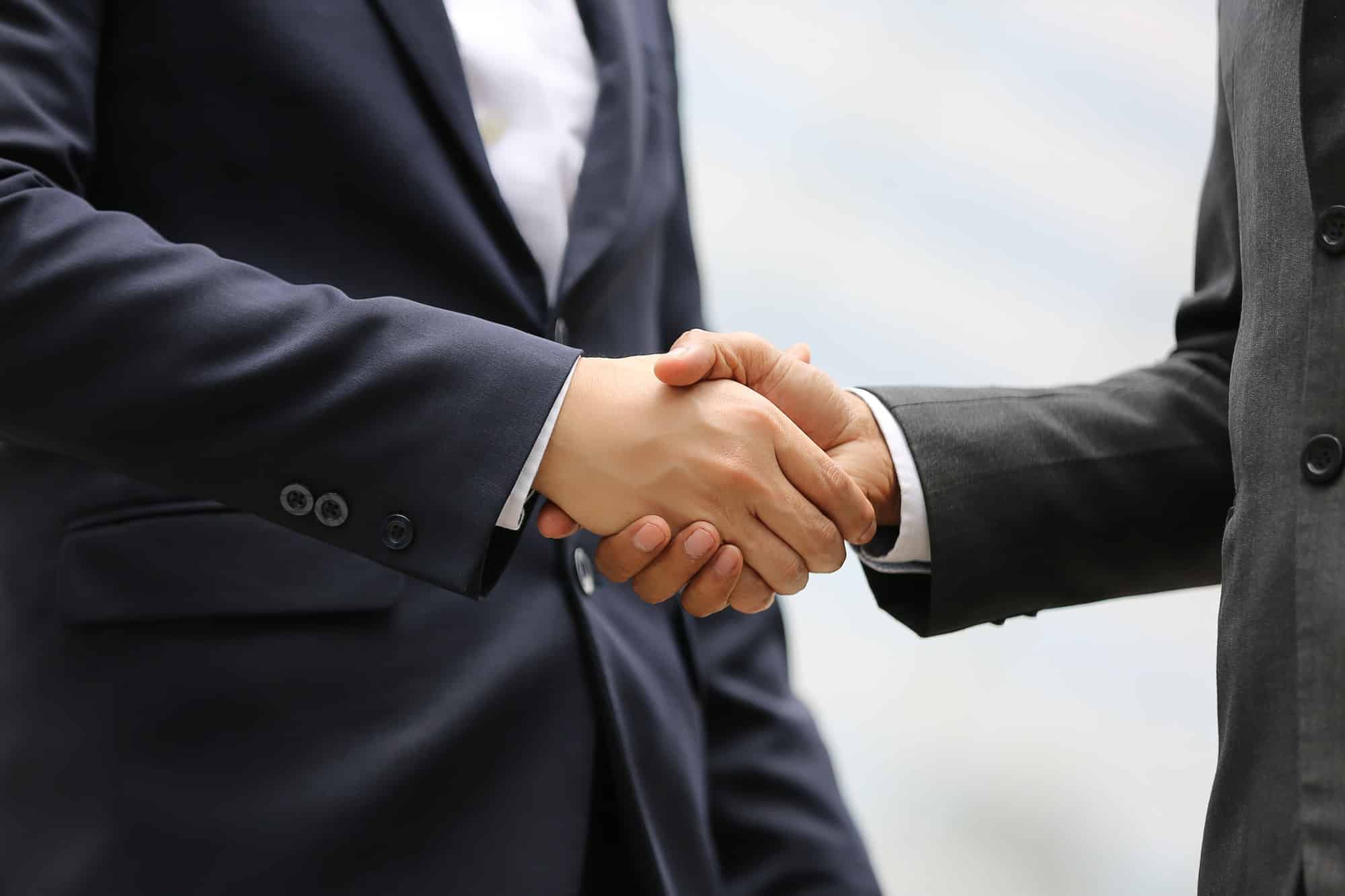 businessman hand shaking.jpg