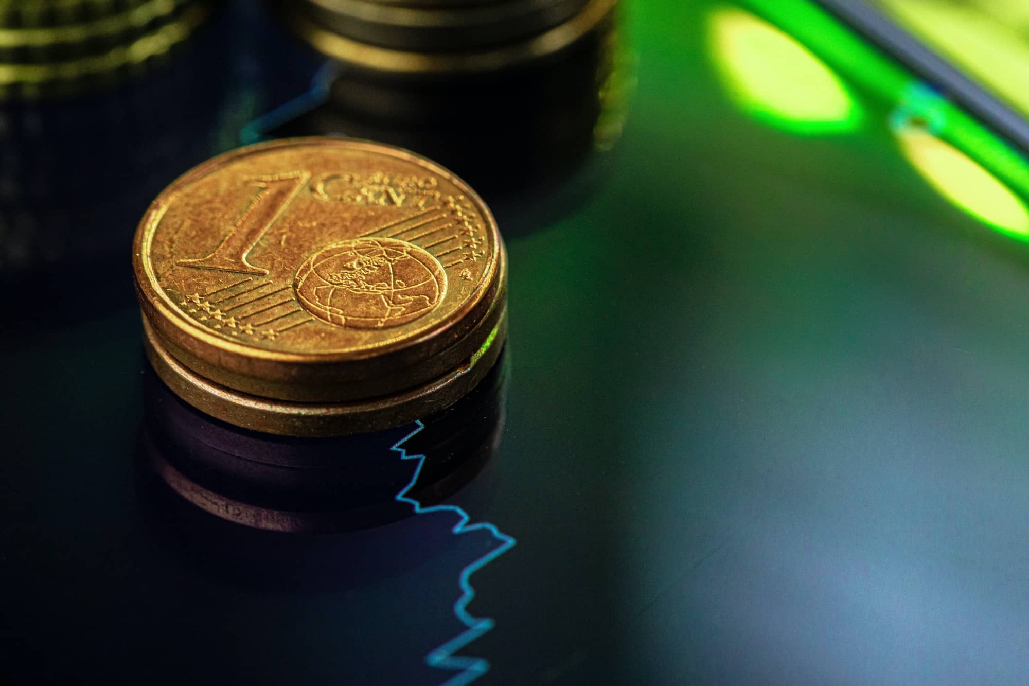 euro coin on stock chart financial investment concept.jpg