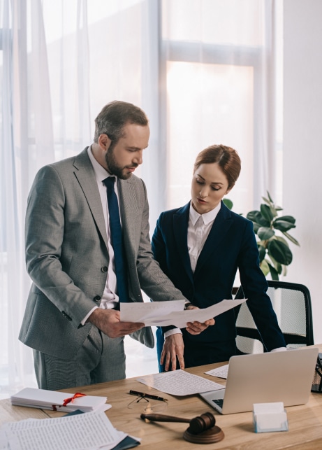 lawyers in suits working together on project at wo.jpg