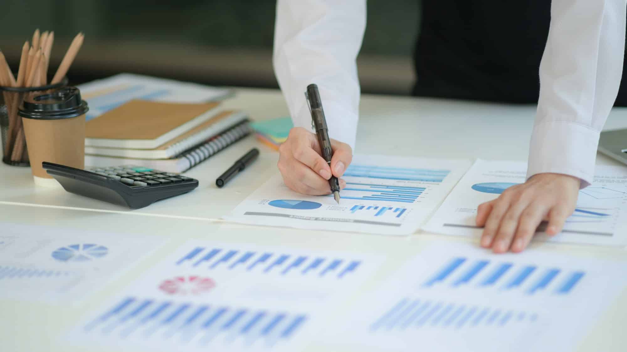 new generation of business professionals analyze their investment plans with charts and graphs .jpg